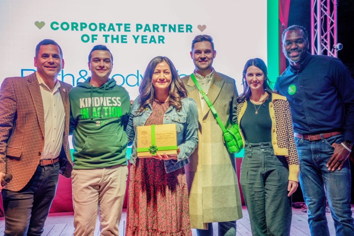 Bath & Body Works team posing holding the Besa Corporate Partner of the Year award.
