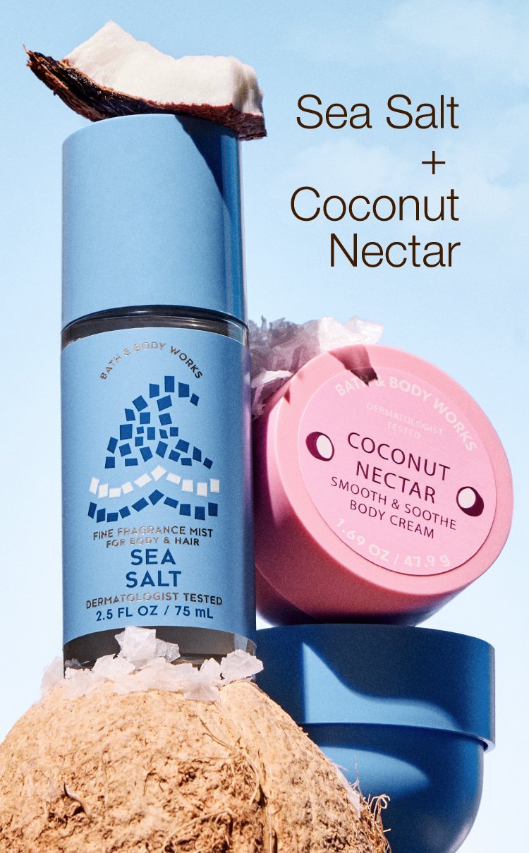 Sea Salt Perfume and coconut nectar body cream stacked on top of a coconut