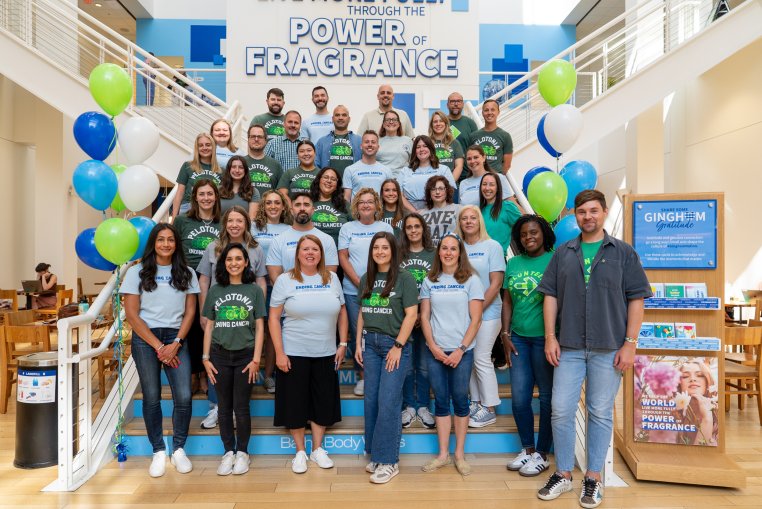 Bath & Body Works associates posing for a photo on steps