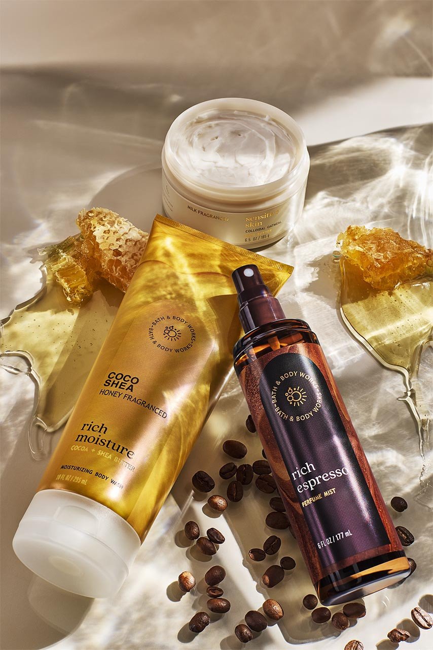 Bath & Body Works wellness products surrounded by honey and coffee beans