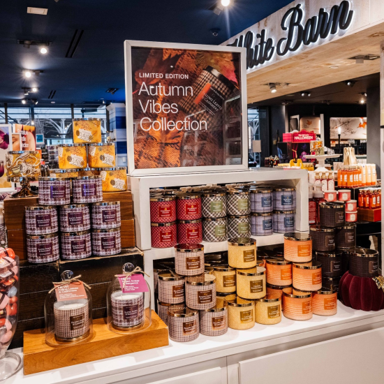 Autumn Vibes Collection product stand with Candles and PocketBacs in a Bath & Body Works store