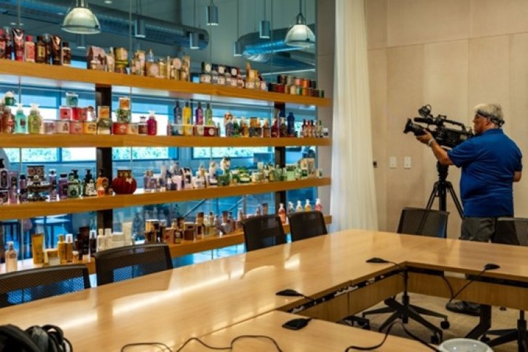 CNBC camera man filming Bath & Body Works product
