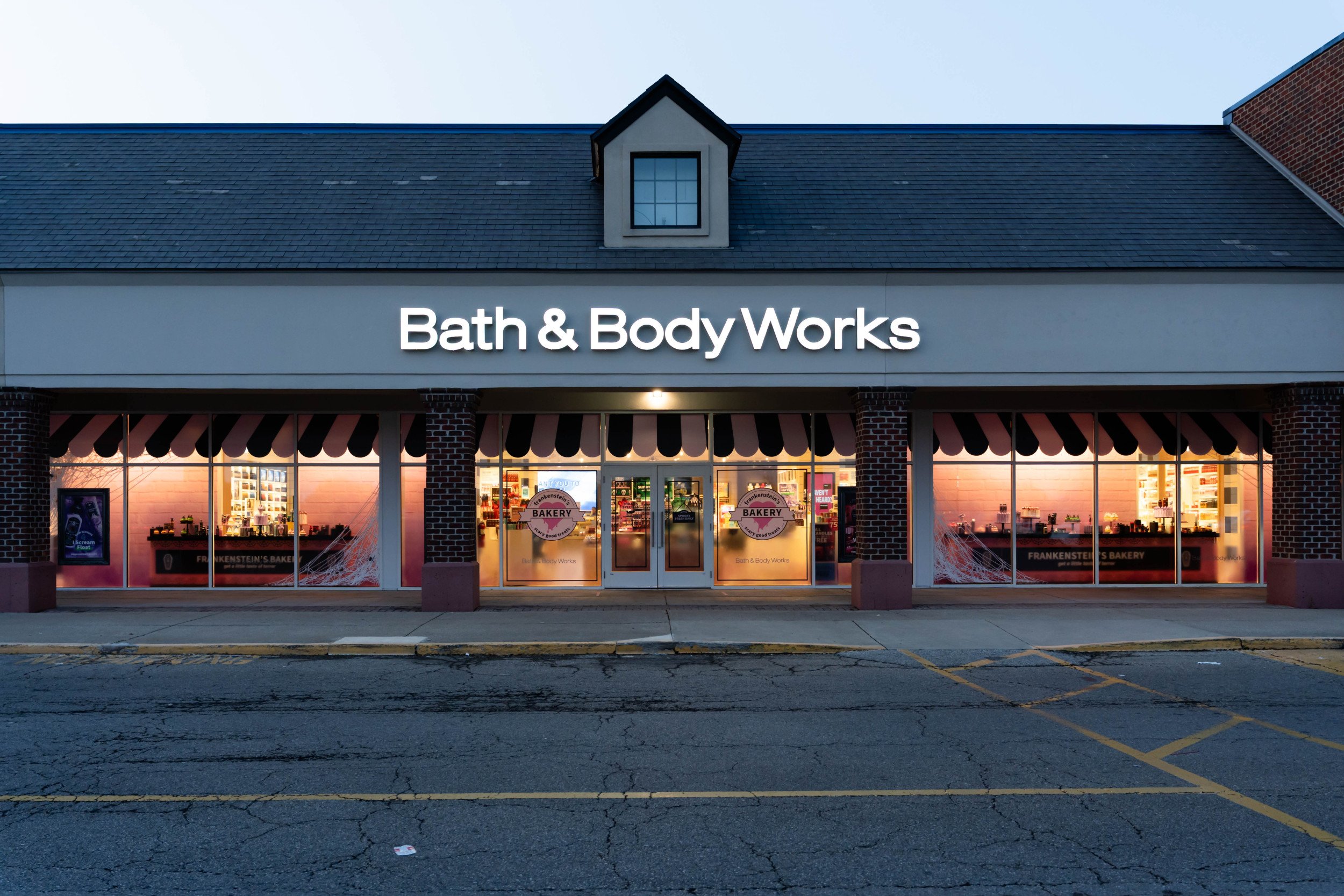 Photo of Bath & Body Works store window with summerween products and decor