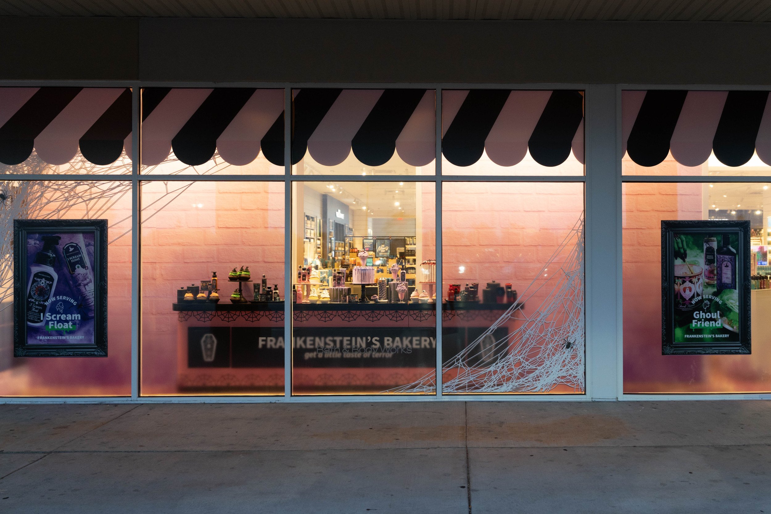Photo of Bath & Body Works store window with summerween products and decor