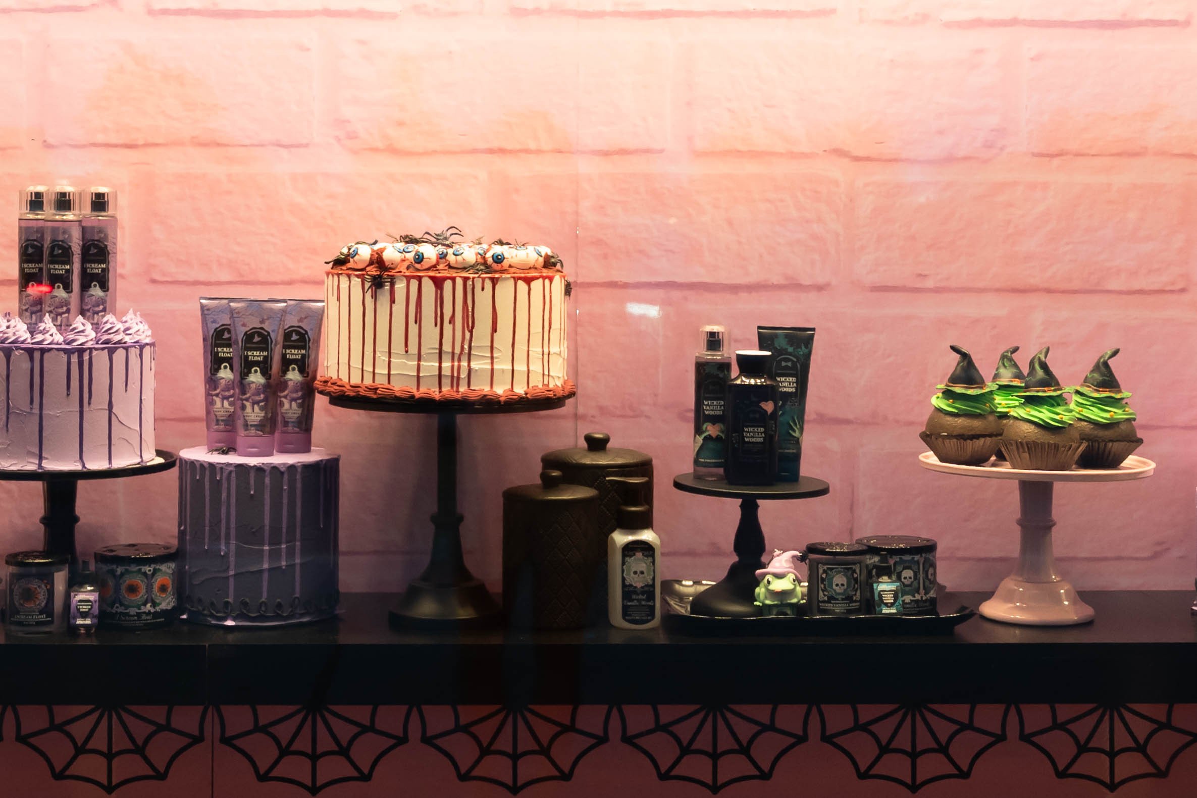 Photo of Bath & Body Works store window with summerween products and decor