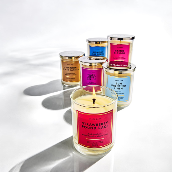 collection of scented candles in glass jars