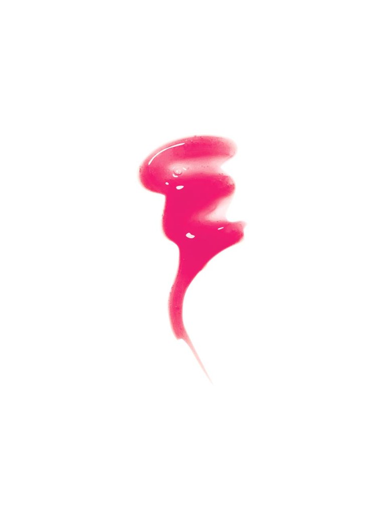 Swatch of pink lip gloss on white background