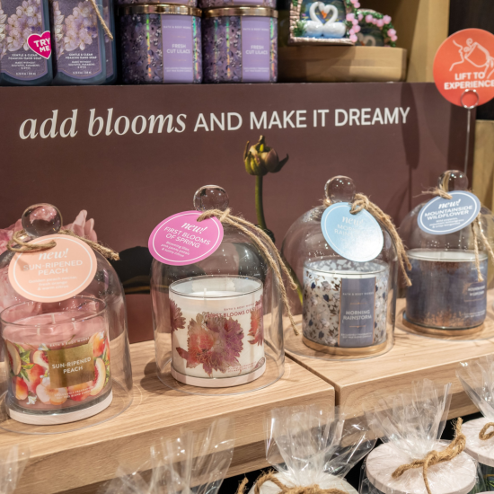 Spring collection candles with decorative covering in a Bath & Body Works store