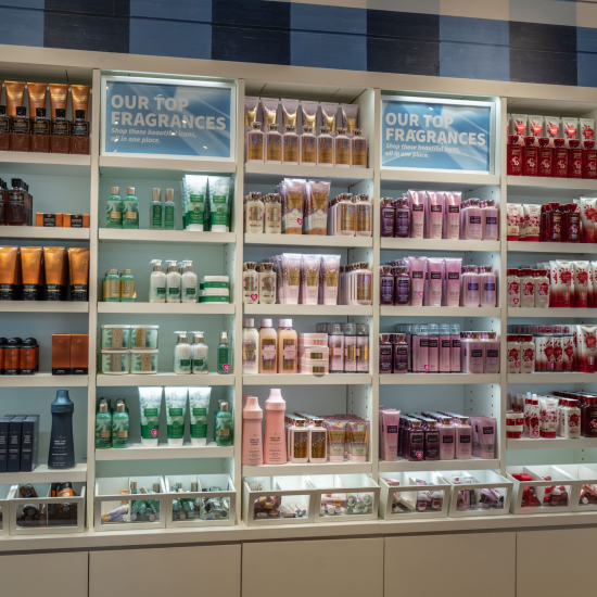 Wall with Mahogany Teakwood, Eucalyptus Spearmint, Champagne Toast, A Thousand Wishes and Japanese Cherry Blossom products in a Bath & Body Works store