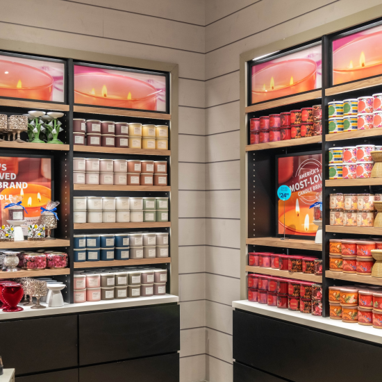 Wall of candles and candle holders in a Bath & Body Works store